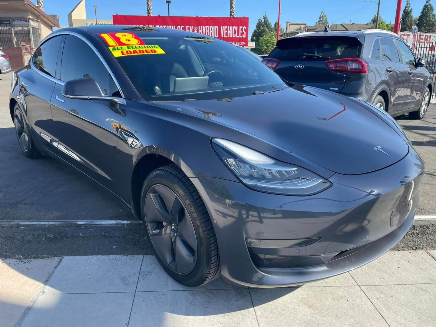 2018 GRAY /Black Tesla Model 3 Long Range Sedan 4D (5YJ3E1EA2JF) with an ELECTRIC engine, 1A transmission, located at 744 E Miner Ave, Stockton, CA, 95202, (209) 944-5770, 37.956863, -121.282082 - Photo#0