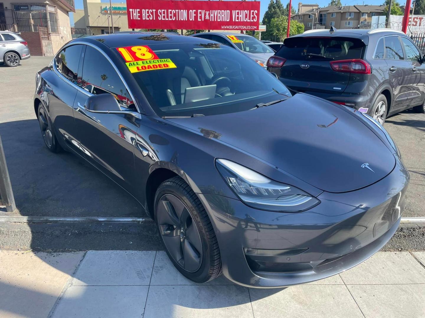 2018 GRAY /Black Tesla Model 3 Long Range Sedan 4D (5YJ3E1EA2JF) with an ELECTRIC engine, 1A transmission, located at 744 E Miner Ave, Stockton, CA, 95202, (209) 944-5770, 37.956863, -121.282082 - Photo#1