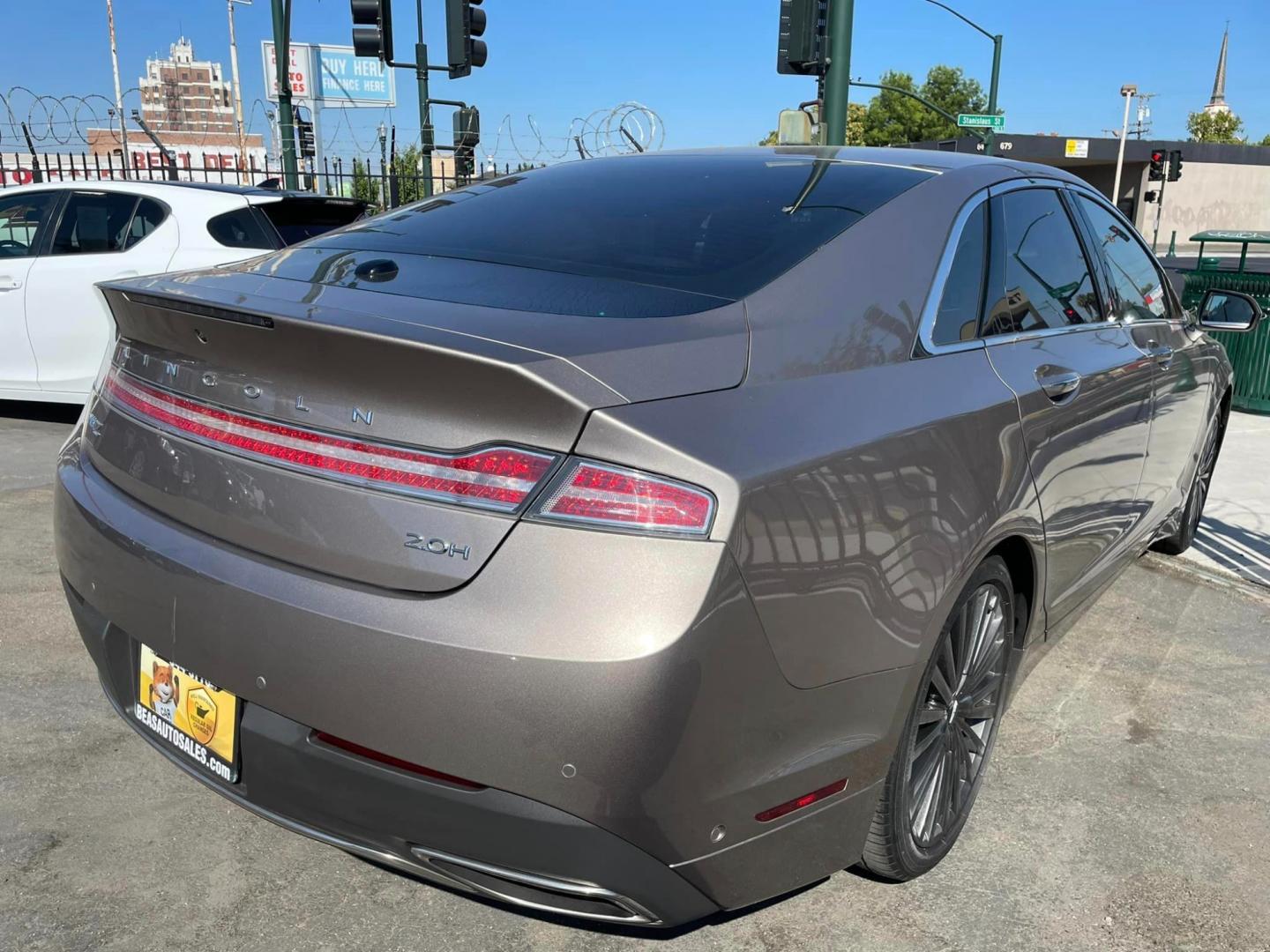 2018 ICED MOCHA /Tan Lincoln MKZ Hybrid Reserve (3LN6L5MU0JR) with an 2.0L L4 DOHC 16V HYBRID engine, CVT transmission, located at 744 E Miner Ave, Stockton, CA, 95202, (209) 944-5770, 37.956863, -121.282082 - Photo#6