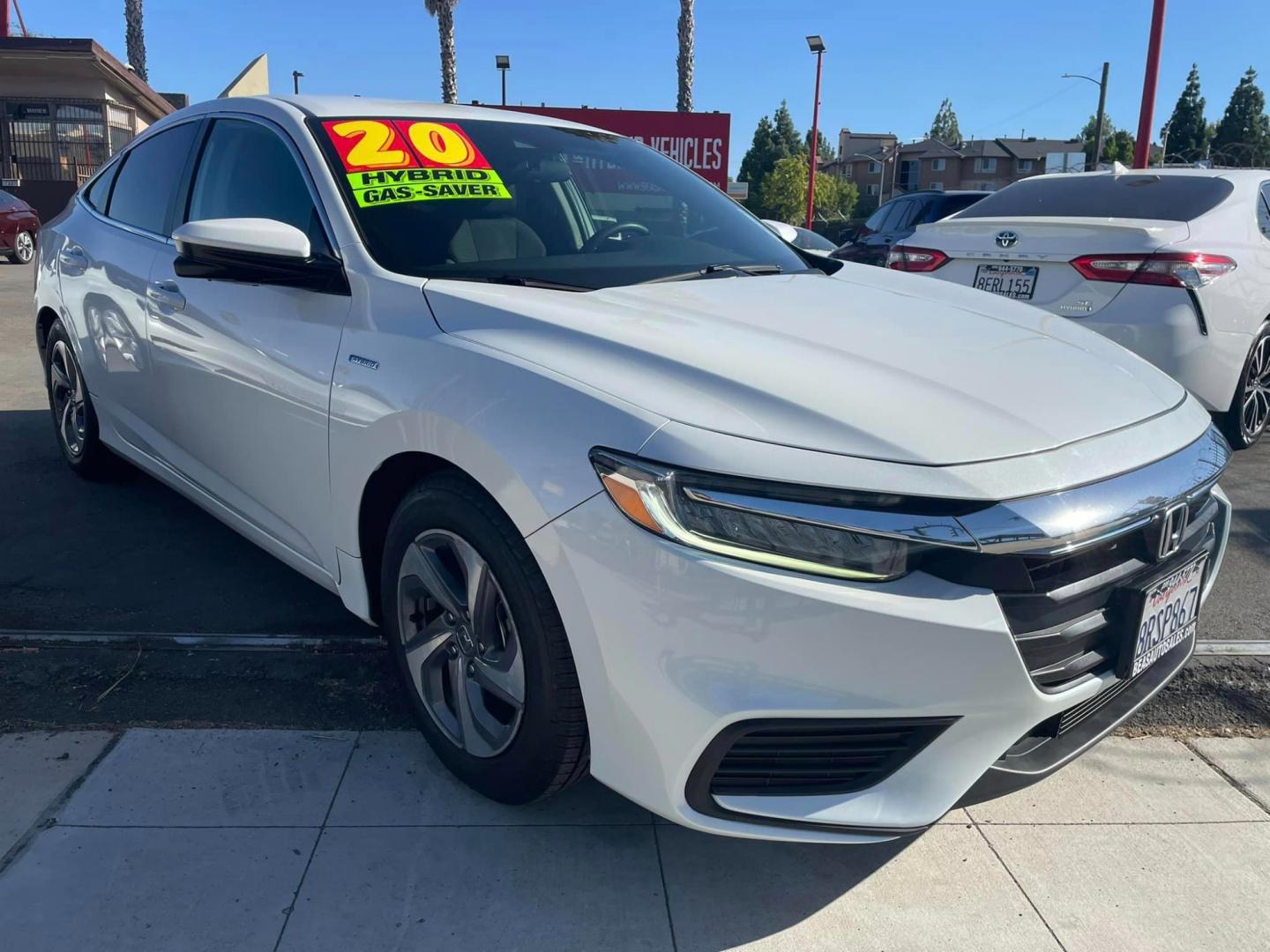 2020 WHITE /BLACK Honda Insight EX (19XZE4F54LE) with an 1.5L L4 DOHC 16V engine, CVT transmission, located at 744 E Miner Ave, Stockton, CA, 95202, (209) 944-5770, 37.956863, -121.282082 - PLUS TAXES AND FEES - Photo#0