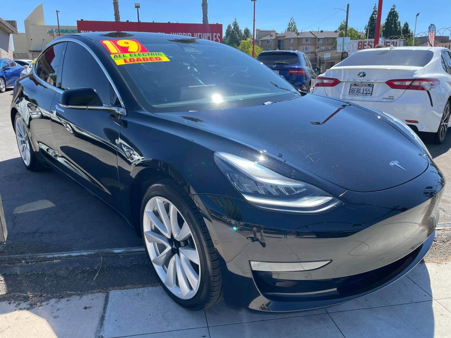 2019 BLACK /BLACK Tesla Model 3 Base (5YJ3E1EA4KF) with an ELECTRIC engine, 1A transmission, located at 744 E Miner Ave, Stockton, CA, 95202, (209) 944-5770, 37.956863, -121.282082 - PLUS TAXES AND FEES - Photo#0