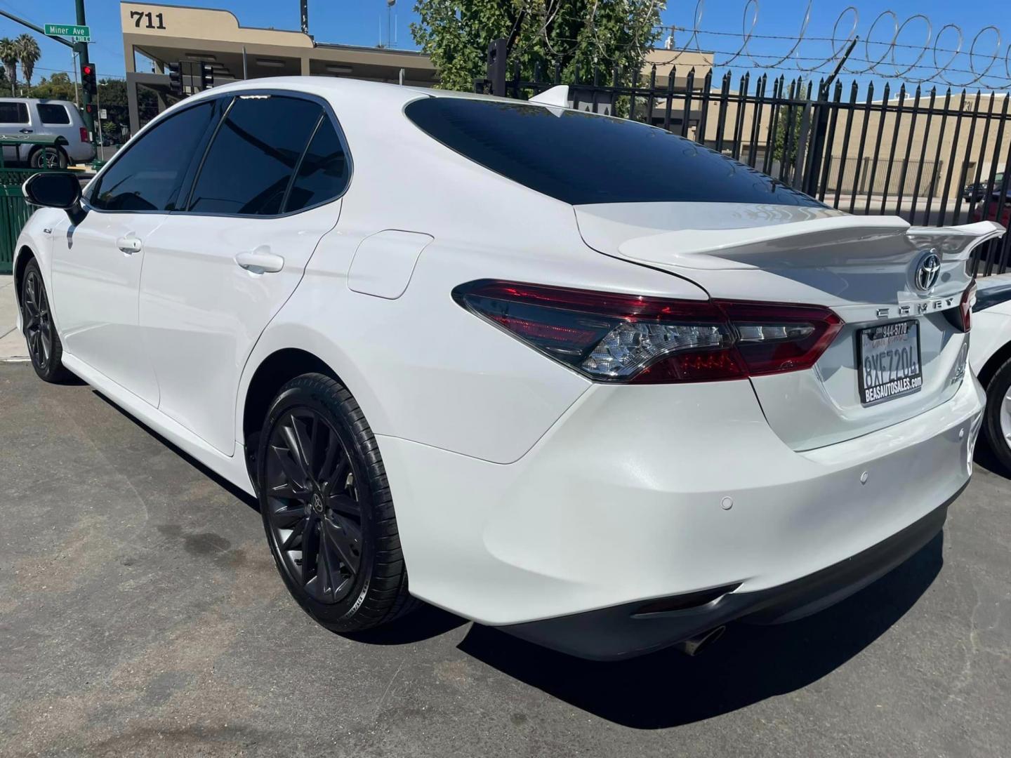 2021 WHITE /BLACK Toyota Camry Hybrid XLE (4T1F31AK2MU) with an 2.5L L4 DOHC 16V HYBRID engine, CVT transmission, located at 744 E Miner Ave, Stockton, CA, 95202, (209) 944-5770, 37.956863, -121.282082 - Photo#12