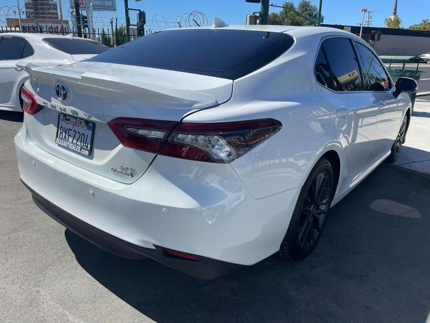 2021 WHITE /BLACK Toyota Camry Hybrid XLE (4T1F31AK2MU) with an 2.5L L4 DOHC 16V HYBRID engine, CVT transmission, located at 744 E Miner Ave, Stockton, CA, 95202, (209) 944-5770, 37.956863, -121.282082 - Photo#13