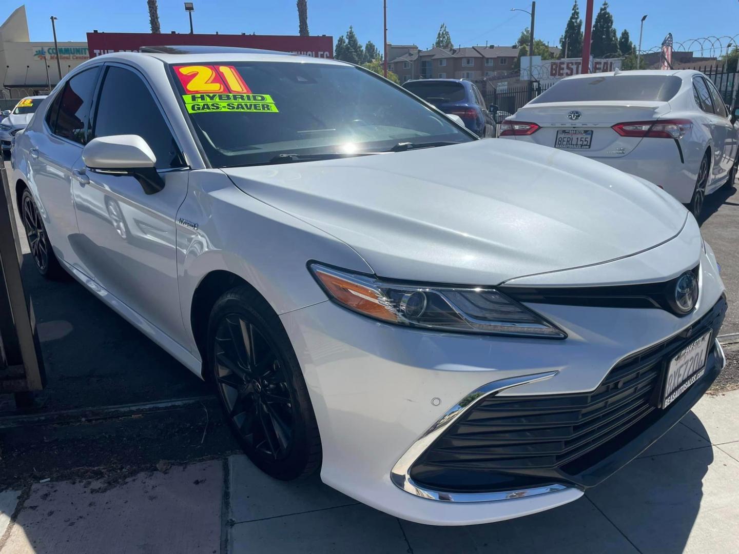 2021 WHITE /BLACK Toyota Camry Hybrid XLE (4T1F31AK2MU) with an 2.5L L4 DOHC 16V HYBRID engine, CVT transmission, located at 744 E Miner Ave, Stockton, CA, 95202, (209) 944-5770, 37.956863, -121.282082 - Photo#1