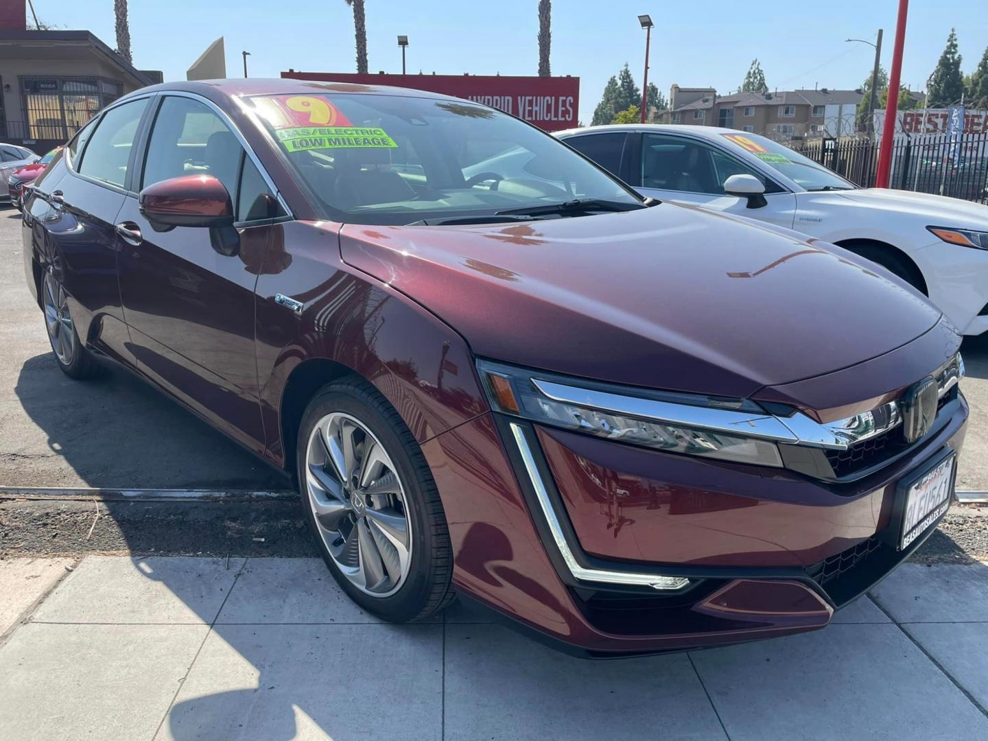 2019 Burgundy Honda Clarity Touring Plug-In Hybrid (JHMZC5F37KC) with an 1.5L L4 DOHC 16V HYBRID engine, CVT transmission, located at 744 E Miner Ave, Stockton, CA, 95202, (209) 944-5770, 37.956863, -121.282082 - PLUS TAXES AND FEES - Photo#0