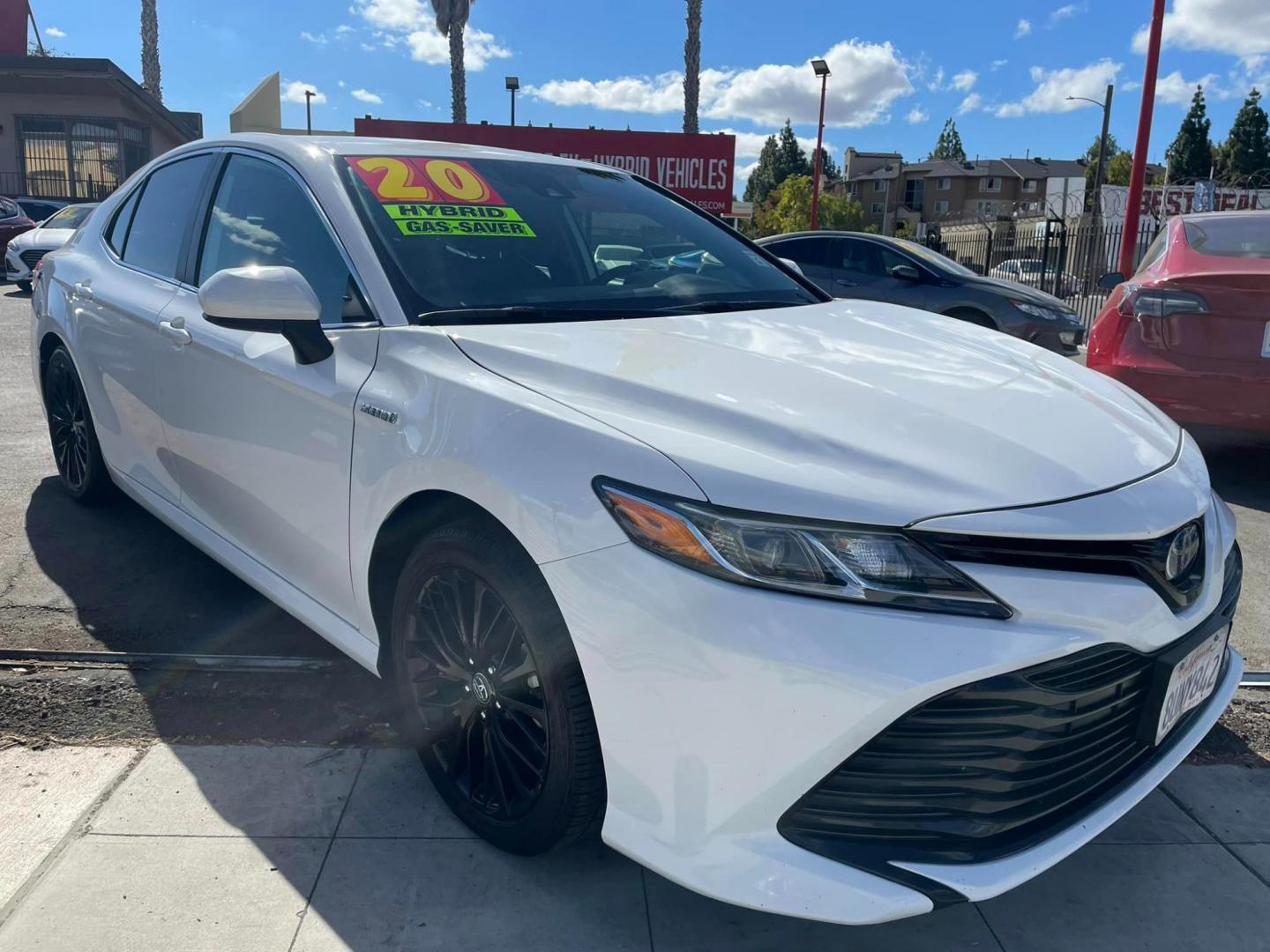 2020 WHITE /BLACK Toyota Camry Hybrid LE (4T1C31AK9LU) with an 2.5L L4 DOHC 16V HYBRID engine, CVT transmission, located at 744 E Miner Ave, Stockton, CA, 95202, (209) 944-5770, 37.956863, -121.282082 - PLUS TAXES AND FEES - Photo#0