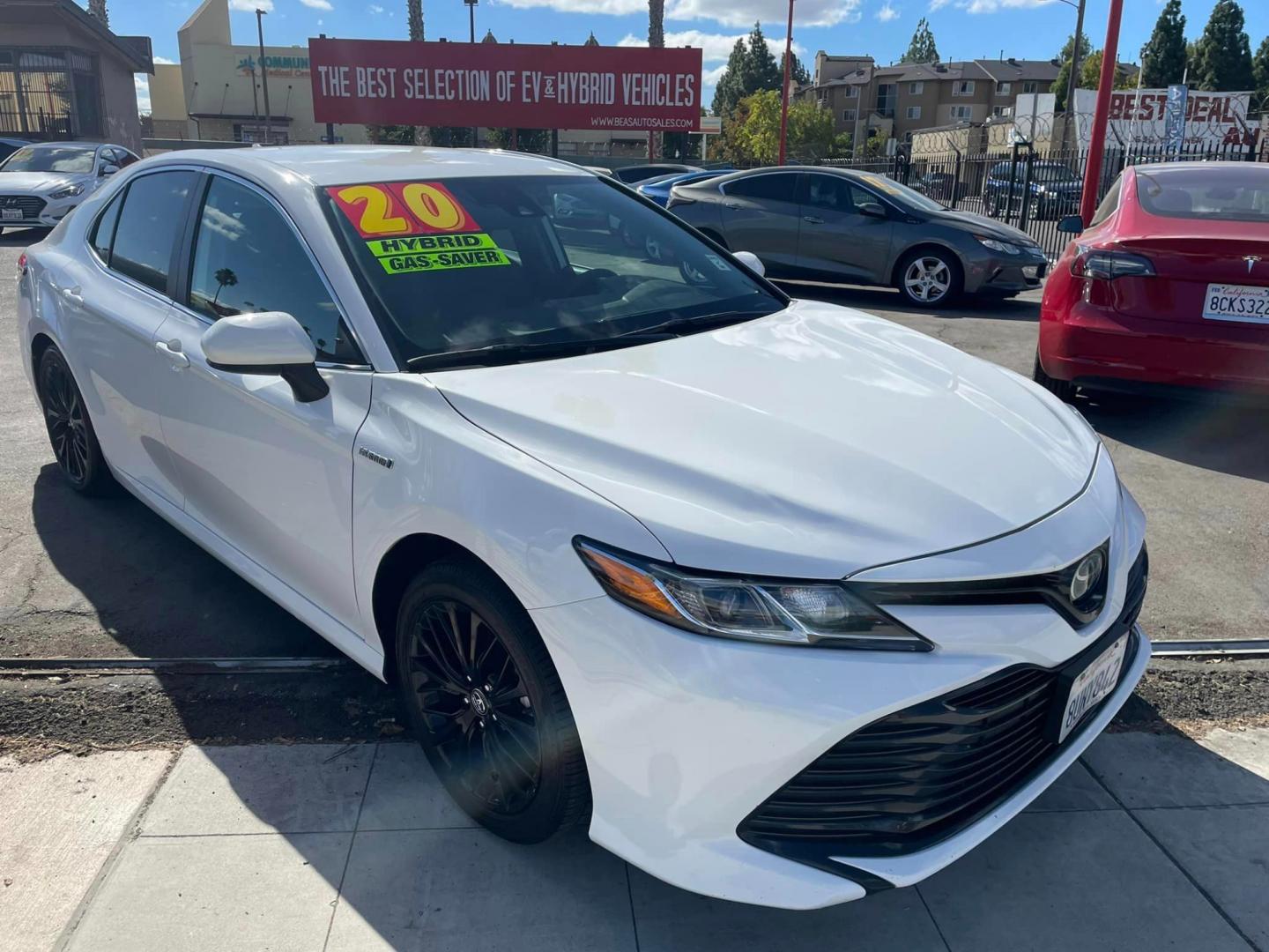 2020 WHITE /BLACK Toyota Camry Hybrid LE (4T1C31AK9LU) with an 2.5L L4 DOHC 16V HYBRID engine, CVT transmission, located at 744 E Miner Ave, Stockton, CA, 95202, (209) 944-5770, 37.956863, -121.282082 - PLUS TAXES AND FEES - Photo#1