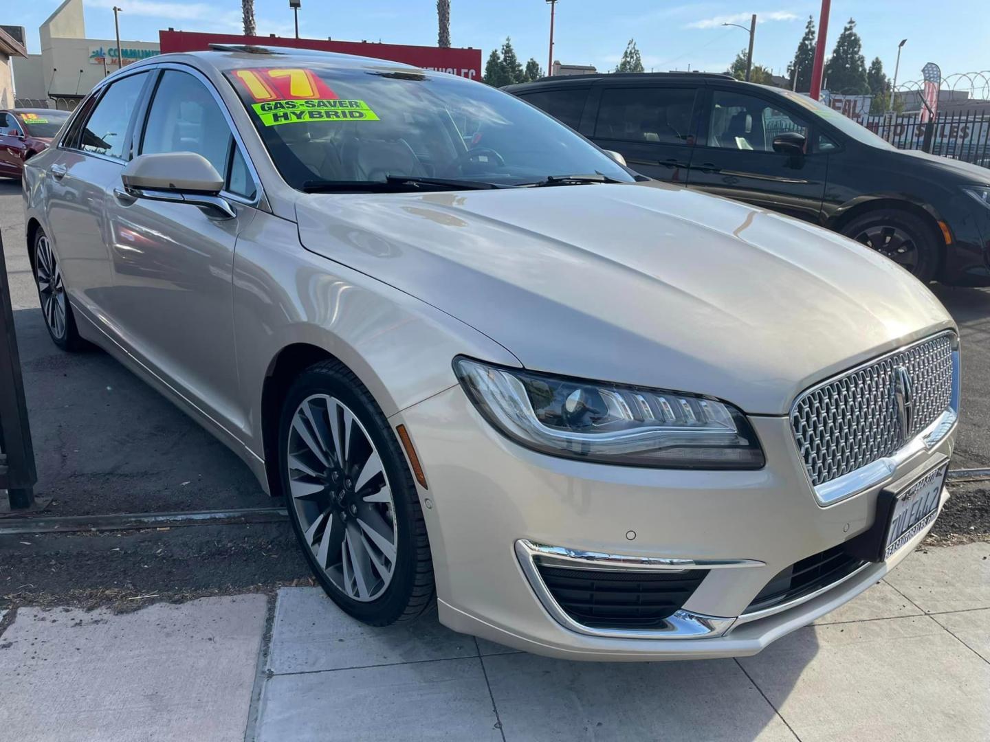 2017 White Gold /White Gold Lincoln MKZ Hybrid Reserve (3LN6L5MUXHR) with an 2.0L L4 DOHC 16V HYBRID engine, CVT transmission, located at 744 E Miner Ave, Stockton, CA, 95202, (209) 944-5770, 37.956863, -121.282082 - Photo#0