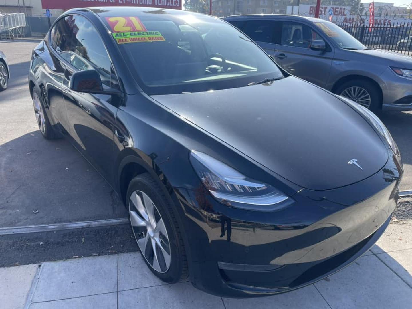 2021 BLACK /BLACK Tesla Model Y Long Range AWD (5YJYGAEE4MF) with an ELECTRIC engine, 1A transmission, located at 744 E Miner Ave, Stockton, CA, 95202, (209) 944-5770, 37.956863, -121.282082 - PLUS TAXES AND FEES - Photo#0