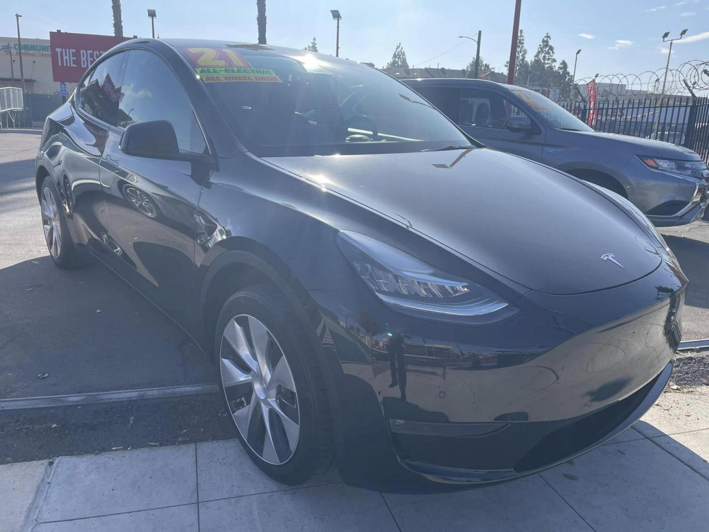 2021 BLACK /BLACK Tesla Model Y Long Range AWD (5YJYGAEE4MF) with an ELECTRIC engine, 1A transmission, located at 744 E Miner Ave, Stockton, CA, 95202, (209) 944-5770, 37.956863, -121.282082 - PLUS TAXES AND FEES - Photo#1