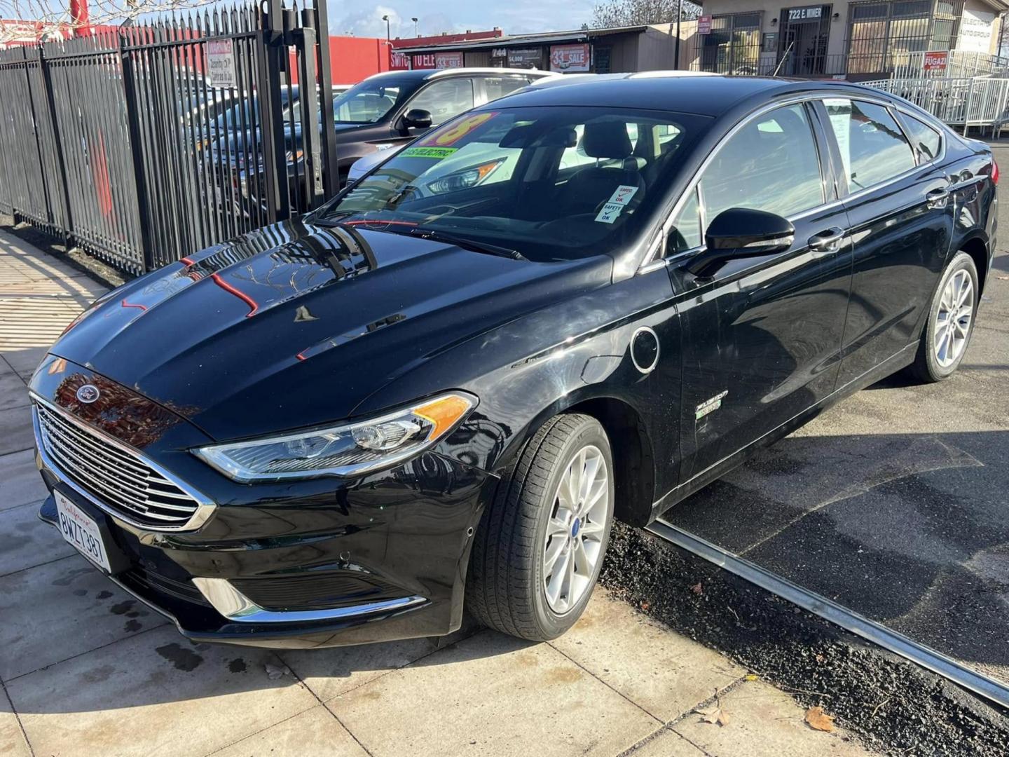 2018 BLACK Ford Fusion Energi SE (3FA6P0PU4JR) with an 2.0L L4 DOHC 16V HYBRID engine, CVT transmission, located at 744 E Miner Ave, Stockton, CA, 95202, (209) 944-5770, 37.956863, -121.282082 - PLUS TAXES AND FEES - Photo#2