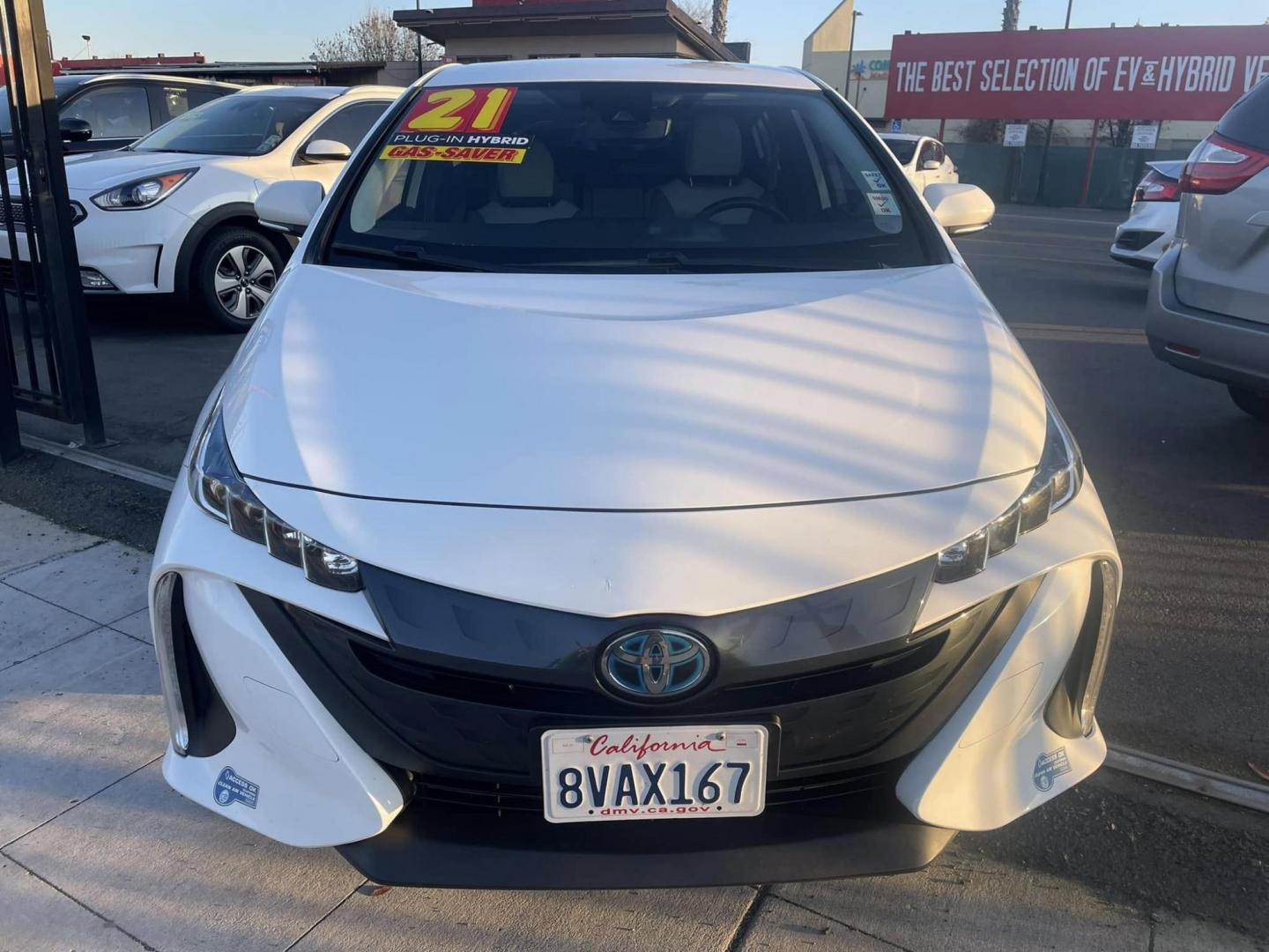 2021 WHITE Toyota Prius Prime LE (JTDKAMFP0M3) with an 1.8L L4 DOHC 16V HYBRID engine, CVT transmission, located at 744 E Miner Ave, Stockton, CA, 95202, (209) 944-5770, 37.956863, -121.282082 - Photo#2